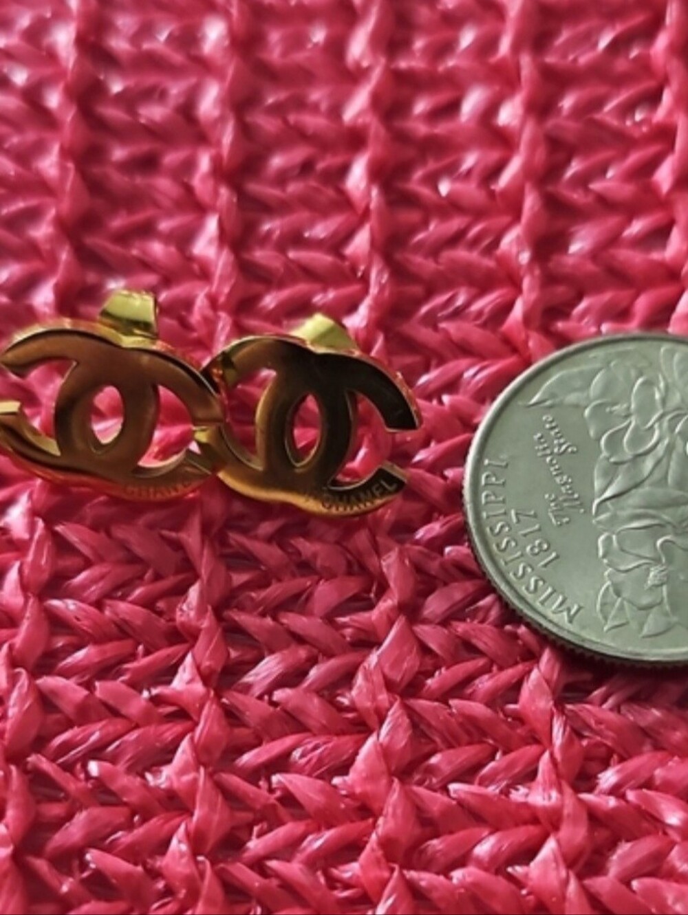 Designer Inspired Gold Interlocking Stud Earrings on Pink Background